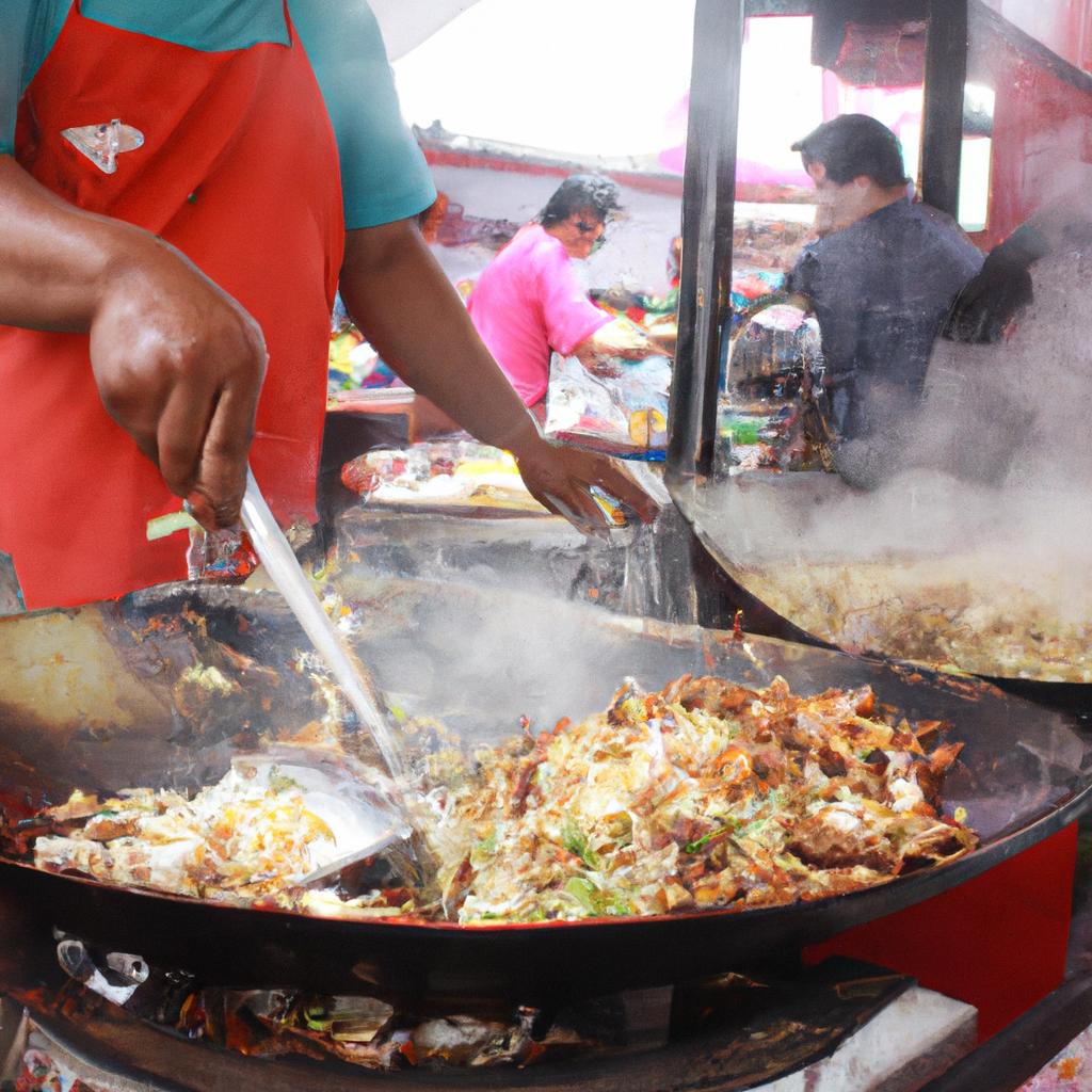 Person cooking at food stall