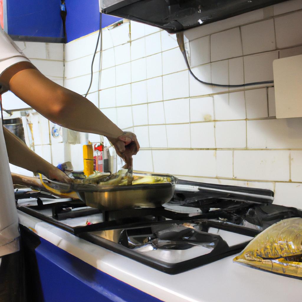 Person cooking in hostel kitchen